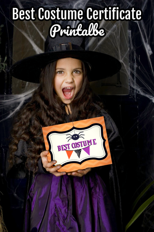 Girl holding Halloween Best Costume Printable Sign